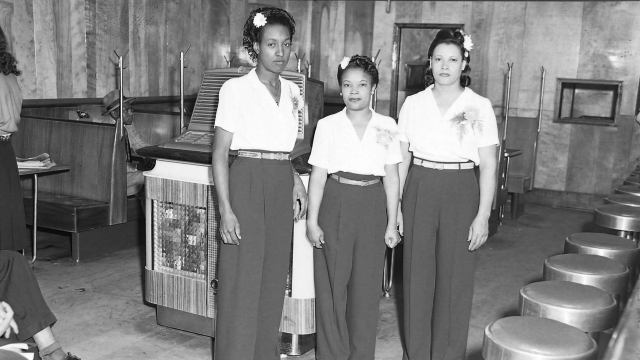 Hostesses in front of Aireon 1200A Airliner Super Deluxe